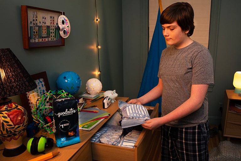 Boy picking out bedwetting underwear